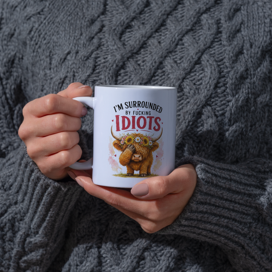 Funny Facepalm Highland Cow "I'm Surrounded by Fucking Idiots" Coffee Mug - Sarcastic Farm Animal Ceramic Tea Cup with Sunflower Crown & Relatable Meme Quote Gift (M1210)