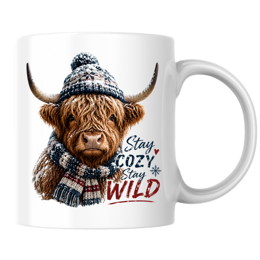Winter Mug "Stay Cozy Stay Wild" Cozy Highland Cow 325ml Ceramic Coffee Mug Winter Knit Beanie Tea Cup with Bobble Hat and Scarf Graphic Gift | Available in Multicolours | Fast Dispatch by UK Seller (M3159)