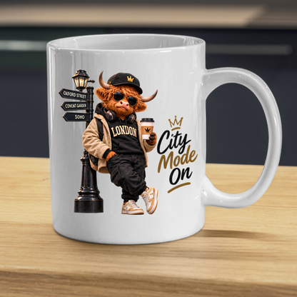 London Mug "City Mode On Cool Highland Cow" City Mode On 325ml Ceramic Coffee Mug – Cool Highland Cow in Cap, Sunglasses & Jacket Leaning on London Street Sign City Gift | Available in Multicolours | Fast Dispatch by UK Seller (M3284)