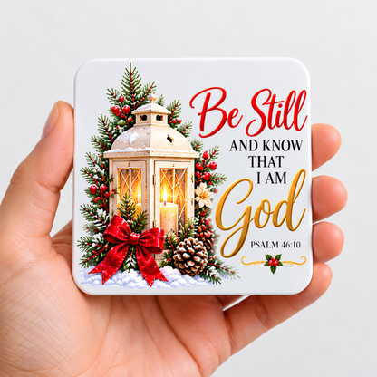 Inspirational Religious Hardboard Coaster "Be Still And Know That I Am God" Graphic 9cm x 9cm Square Drinks Coaster “ White Vintage Lantern with Red Bow, Pine Branches & Pinecones Novelty Mat | Christian Glossy Gift | Fast Dispatch by UK Seller (C3035)