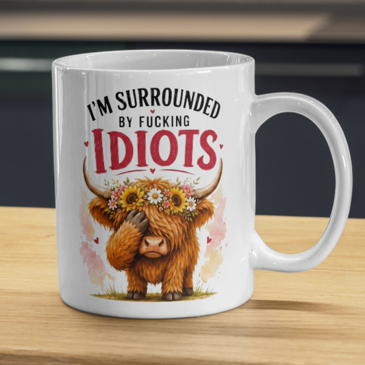 Funny Facepalm Highland Cow "I'm Surrounded by Fucking Idiots" Coffee Mug - Sarcastic Farm Animal Ceramic Tea Cup with Sunflower Crown & Relatable Meme Quote Gift (M1210)