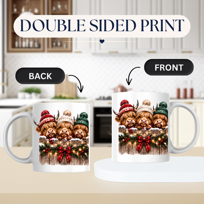 Highland Cows Christmas Fence Mug "Merry & Bright" Festive Highland Cows 325ml Ceramic Coffee Mug – Three Cute Cows in Winter Bobble Hats Behind Snowy Fence with Fairy Lights & Red Tartan Bow | Christmas Gift | Fast Dispatch by UK Seller (M3429)