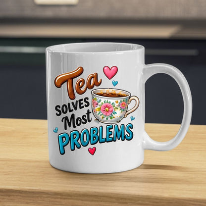 Humorous Mug "Tea Solves Most Problems" 325ml Ceramic Coffee Mug – Funny British Cuppa Tea Cup with Vintage Floral Teacup & Hearts Graphic Gift | Available in Multicolours | Fast Dispatch by UK Seller (M1314)