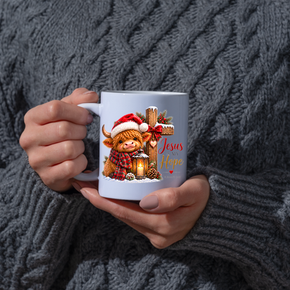 Christmas Mug "Jesus Is My Hope Highland Cow" Jesus Is My Hope Highland Cow 325ml Ceramic Coffee Mug – Festive Highland Coo Mug with Santa Hat Wooden Cross Lantern Christian Holiday Gift | Available in Multicolours | Fast Dispatch by UK Seller (M3305)