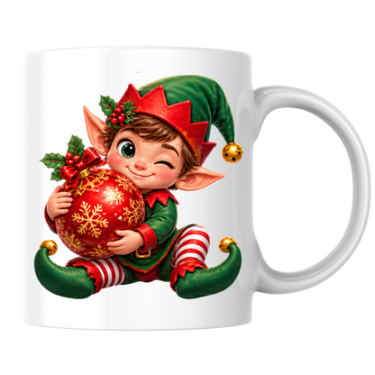 Christmas Mug "Winking Christmas Boy Elf Red Bauble" Winking Christmas Boy Elf 325ml Ceramic Coffee Mug – Cute Festive Tea Cup with Elf Outfit Jingle Bells Snowflake Bauble Graphic Gift | Available in Multicolours | Fast Dispatch by UK Seller (M3186)