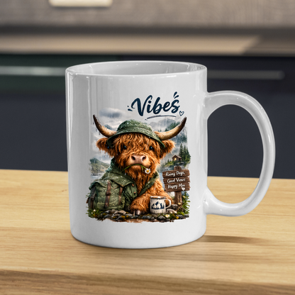 Cozy Mug "Vibes - Rainy Days, Good Views, Happy Moo" Hiking Highland Cow 325ml Ceramic Coffee Mug Whimsical Outdoor Tea Cup with Rain Hat and Mountain Scene Graphic Gift | Available in Multicolours | Fast Dispatch by UK Seller (M3156)