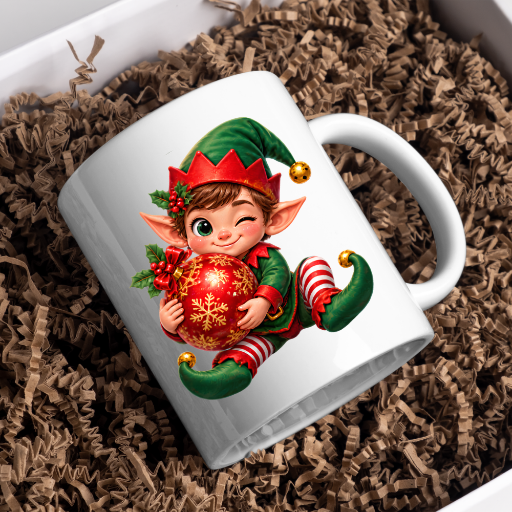 Christmas Mug "Winking Christmas Boy Elf Red Bauble" Winking Christmas Boy Elf 325ml Ceramic Coffee Mug – Cute Festive Tea Cup with Elf Outfit Jingle Bells Snowflake Bauble Graphic Gift | Available in Multicolours | Fast Dispatch by UK Seller (M3186)