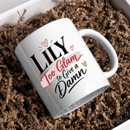 Personalized Name Mug "Lily Too Glam To Give A Damn" Lily Too Glam To Give A Damn 325ml Ceramic Coffee Mug – Custom Name Typography Slogan with Pink Brushstroke Banner & Floating Hearts | Funny Gift | Fast Dispatch by UK Seller (M3452)