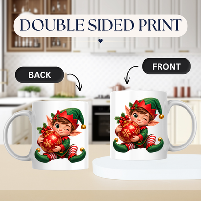 Christmas Mug "Winking Christmas Boy Elf Red Bauble" Winking Christmas Boy Elf 325ml Ceramic Coffee Mug – Cute Festive Tea Cup with Elf Outfit Jingle Bells Snowflake Bauble Graphic Gift | Available in Multicolours | Fast Dispatch by UK Seller (M3186)