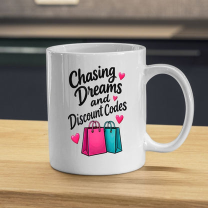 Humorous Mug "Chasing Dreams and Discount Codes" 325ml Ceramic Coffee Mug Funny Shopping Lover Tea Cup with Pink & Teal Shopping Bags & Hearts Graphic Gift | Available in Multicolours | Fast Dispatch by UK Seller (M1316)