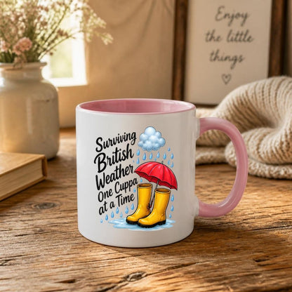 Humorous Mug "Surviving British Weather One Cuppa at a Time" 325ml Ceramic Coffee Mug Funny Rainy Day Tea Cup with Yellow Wellies, Red Umbrella & Raindrops Graphic Gift | Available in Multicolours | Fast Dispatch by UK Seller (M1318)