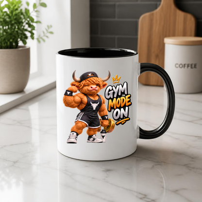 Gym Mug "Gym Mode ON Muscular Highland Cow" Gym Mode ON 325ml Ceramic Coffee Mug – Muscular Winking Highland Cow in Tank Top & Cap Flexing Bicep Holding Gold Dumbbell Shaker Gym Fitness Gift | Available in Multicolours | Fast Dispatch by UK Seller (M3271)
