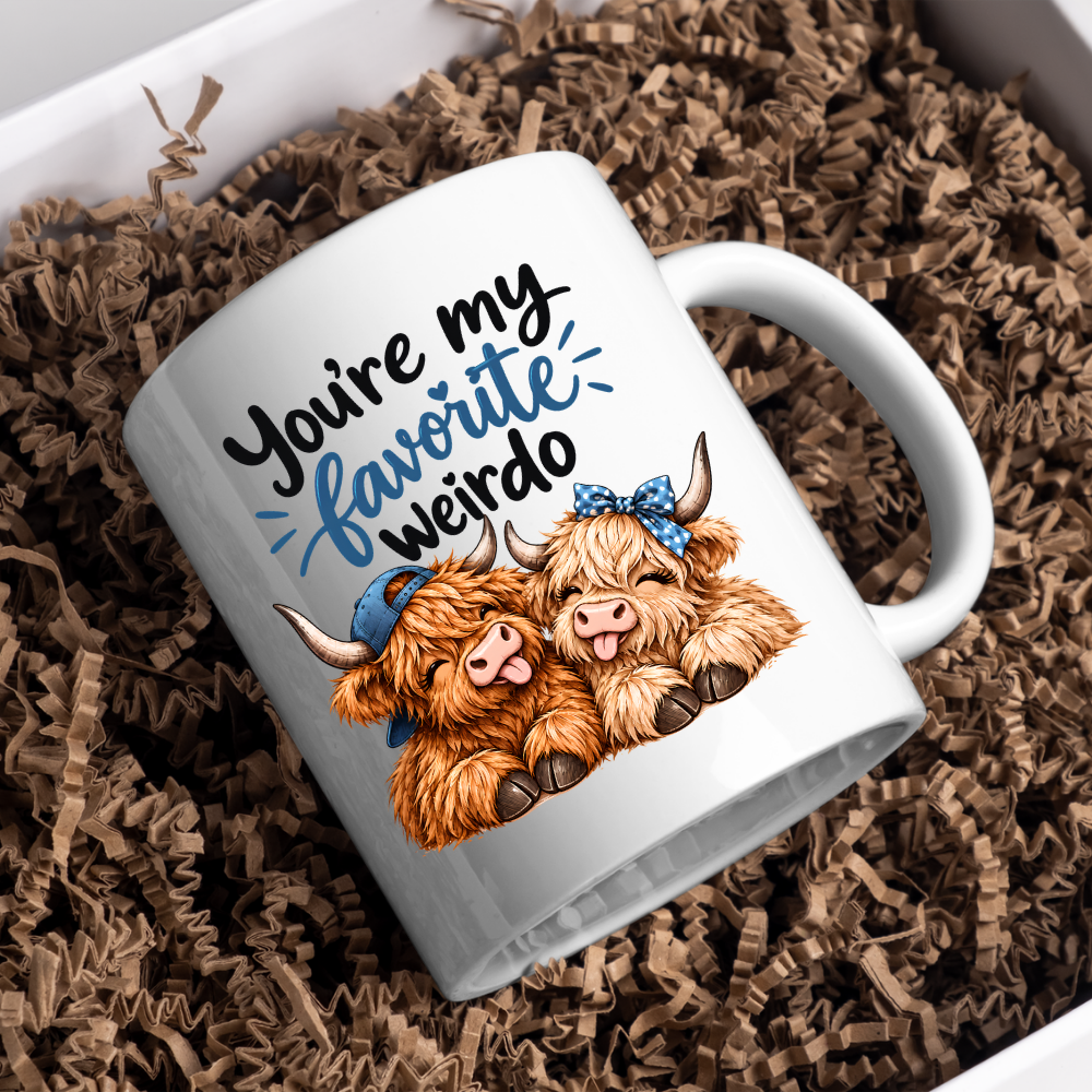 Funny Highland Cow Mug "You're My Favorite Weirdo" You're My Favorite Weirdo 325ml Ceramic Coffee Mug – Cute Couple Highland Cows with Blue Baseball Cap & Polka Dot Bow | Romantic & Funny Gift | Fast Dispatch by UK Seller (M3454)
