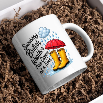Humorous Mug "Surviving British Weather One Cuppa at a Time" 325ml Ceramic Coffee Mug Funny Rainy Day Tea Cup with Yellow Wellies, Red Umbrella & Raindrops Graphic Gift | Available in Multicolours | Fast Dispatch by UK Seller (M1318)